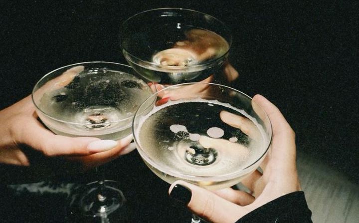 Guests clinking champagne coupes at The Rock