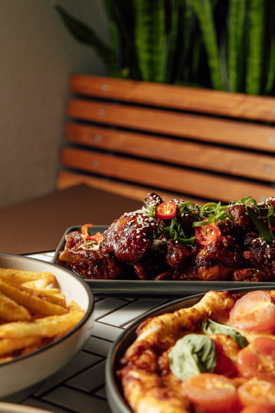 Korean fried chicken wings with chilli and sesame on a share board at The Rock Toowoomba