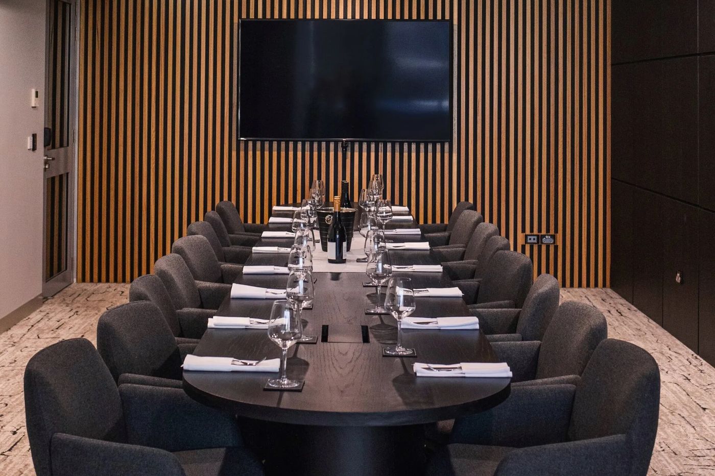 The boardroom at The Rock Toowoomba set for a meeting with a large screen
